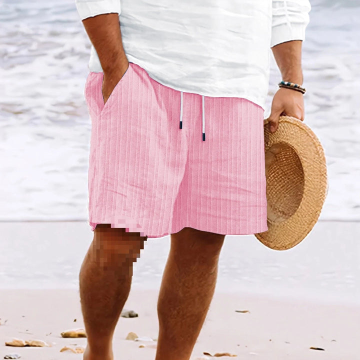 Detail of men's chino shorts waistband featuring black drawstring closure and structured fabric construction