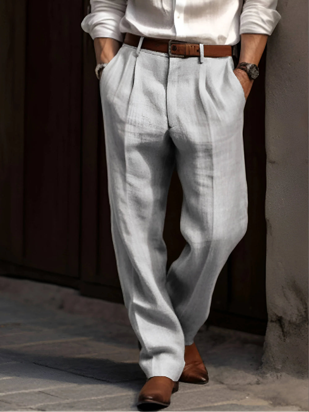 Side view of men's pleated dress pants showing front pleat detail and straight leg cut