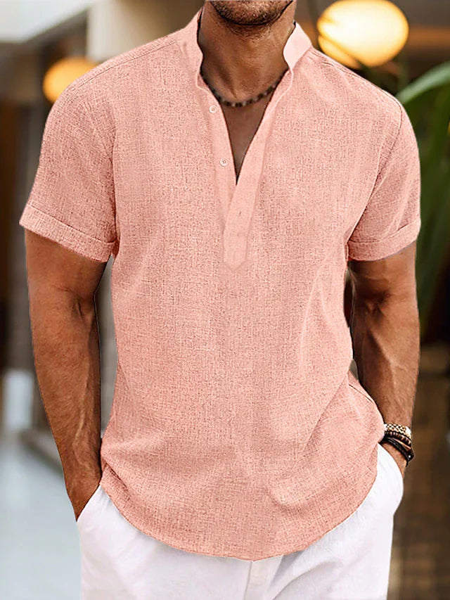 Men's short sleeve henley shirt in coral pink with button placket and textured fabric