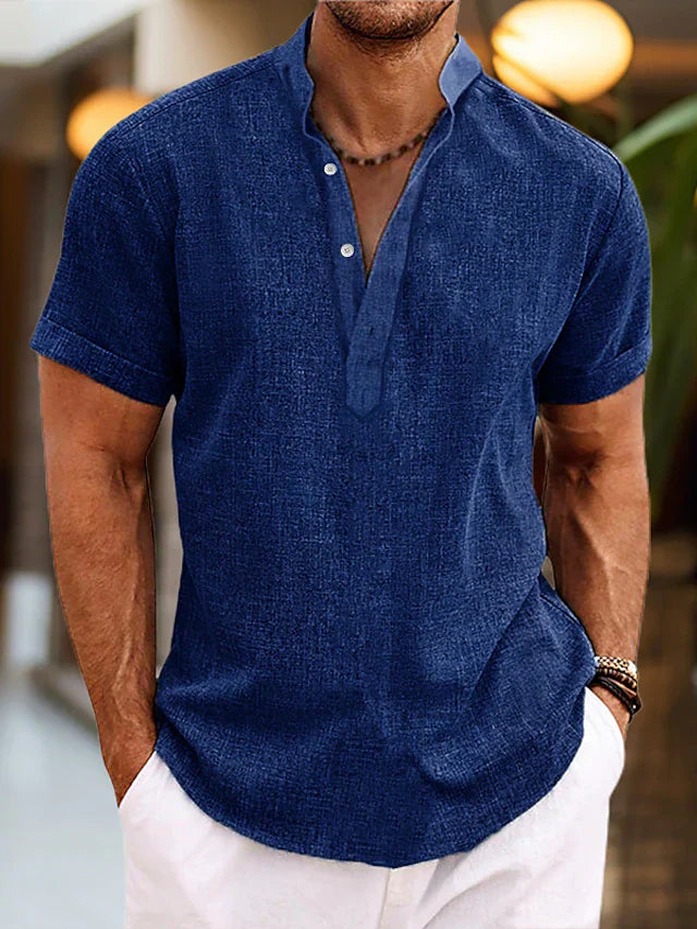 Men's textured henley shirt styled with white pants for casual summer look