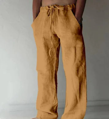 Men's straight-leg pants in white showing full-length cut and breathable fabric construction