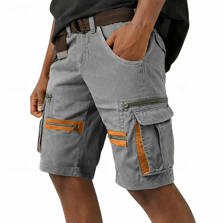 Side view of men's cargo shorts showing functional cargo pockets with zipper closures and contrast trim accents