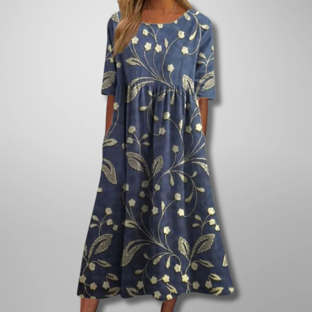 Kennedy cotton summer dress in navy blue with white floral embroidery and relaxed midi silhouette
