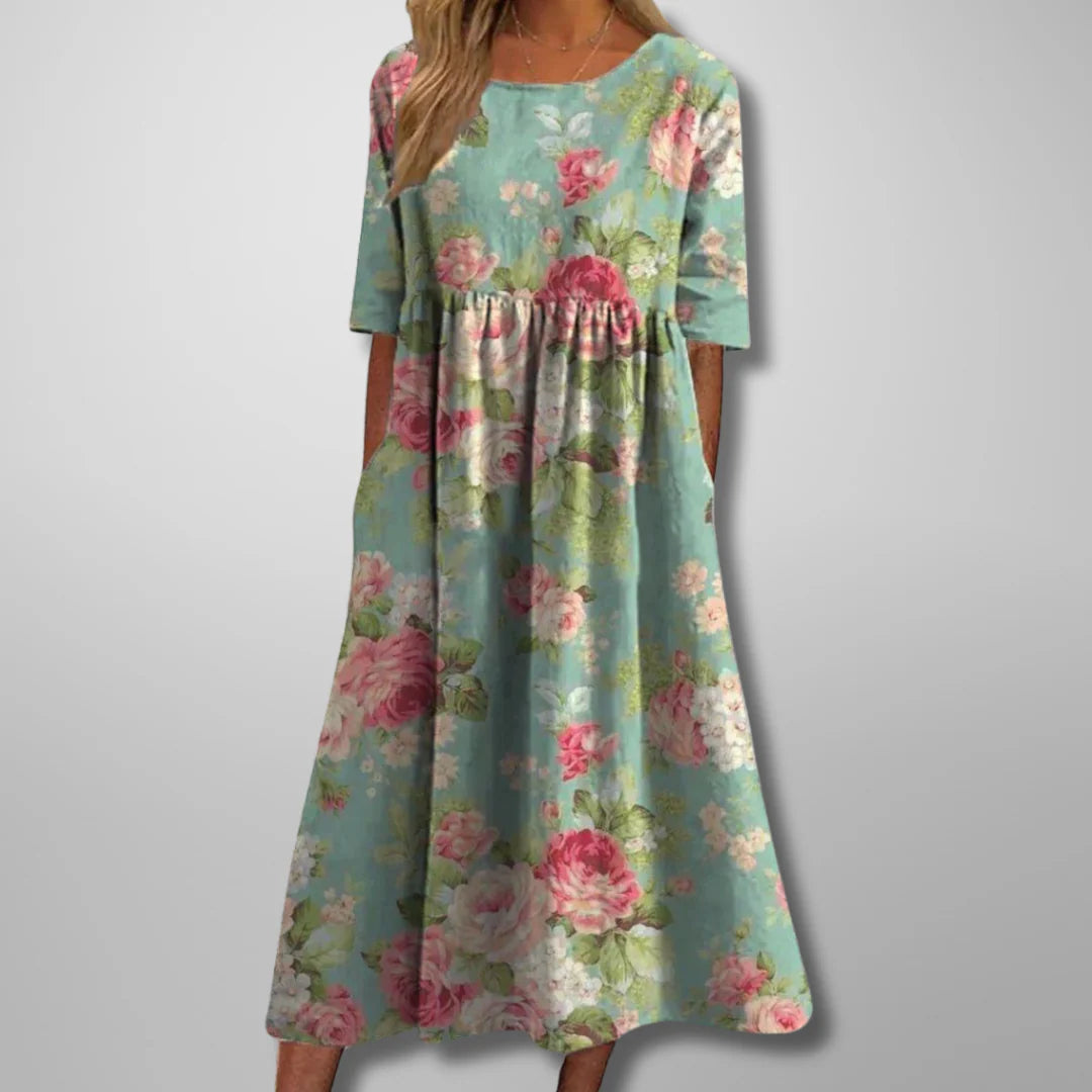 Floral midi dress with elbow-length sleeves and gathered waist detail for summer wear