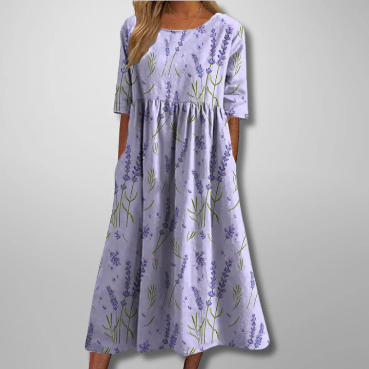 Relaxed fit cotton summer dress featuring delicate botanical print and flowing skirt