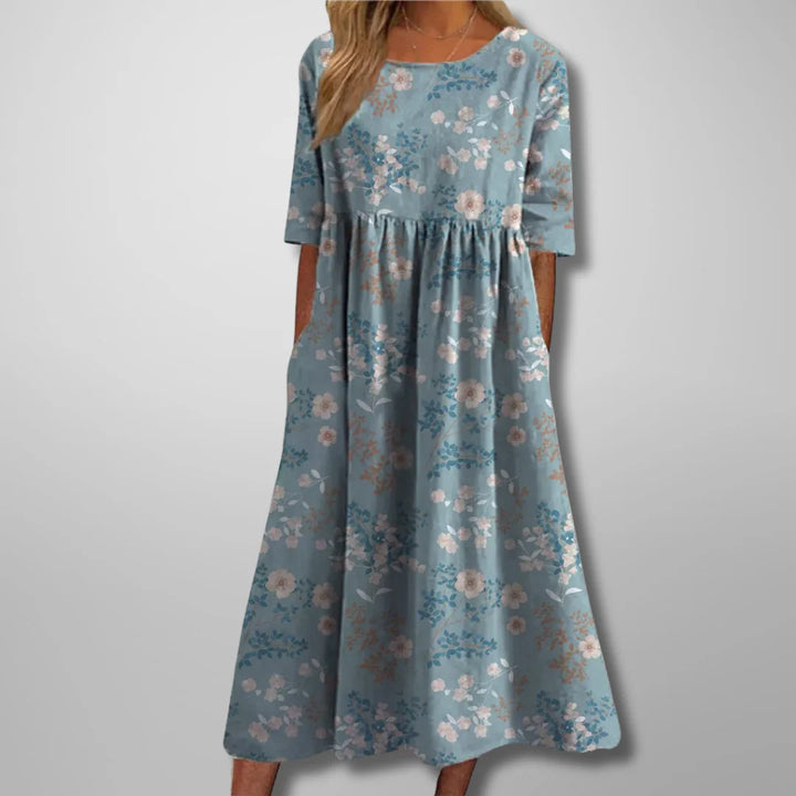 Cotton summer dress with rounded neckline and natural drape for casual occasions
