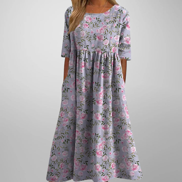 Floral embroidered midi dress in lightweight fabric with elbow-length sleeves and relaxed fit