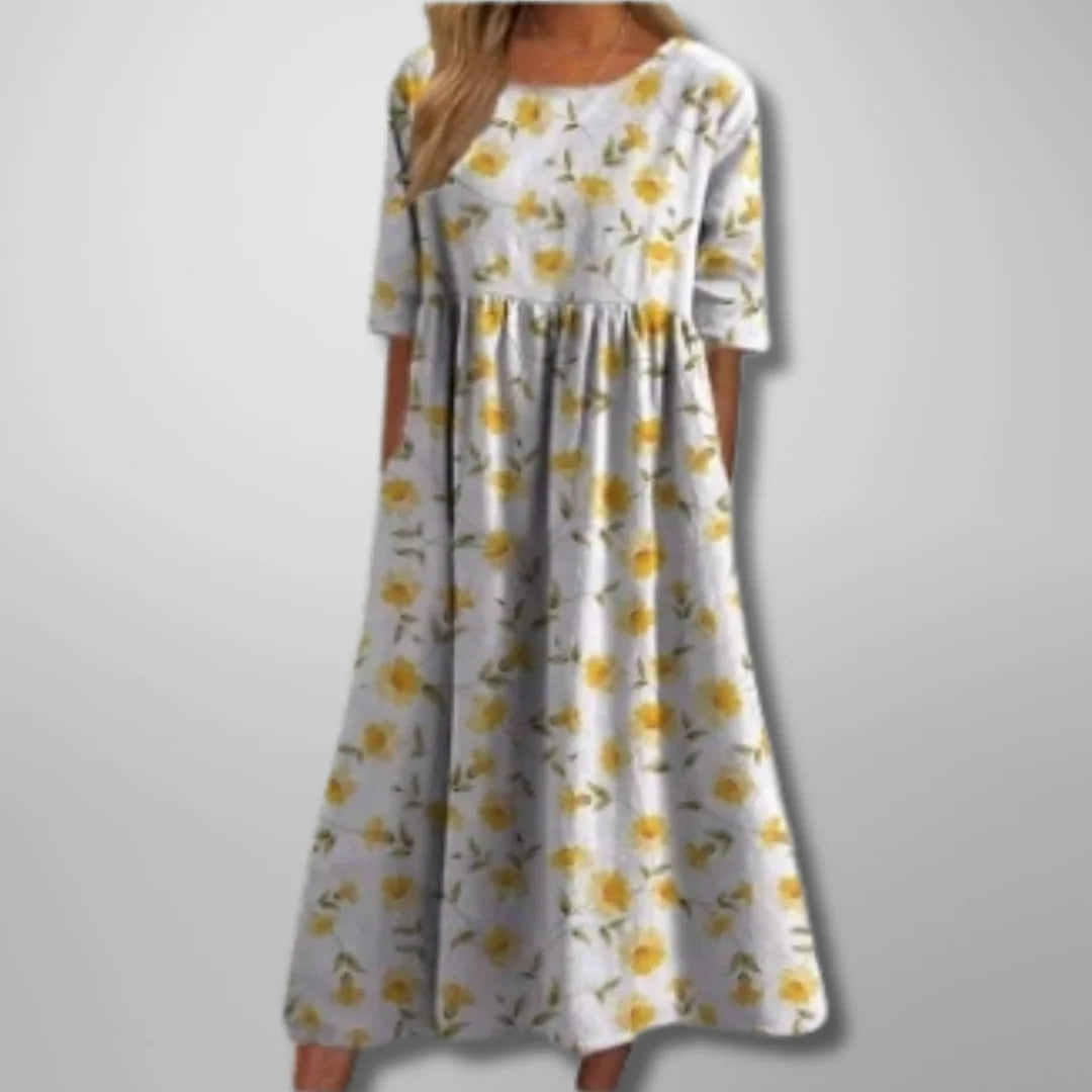 Summer midi dress with botanical print detail and gathered waist for flattering silhouette