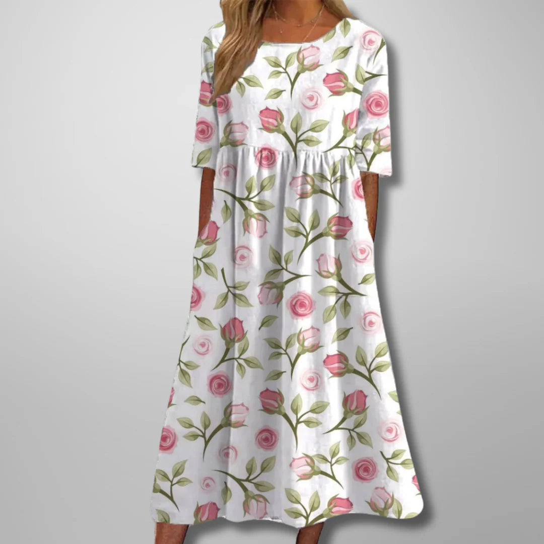 Breathable cotton summer dress in flowing midi length with delicate floral embroidery throughout
