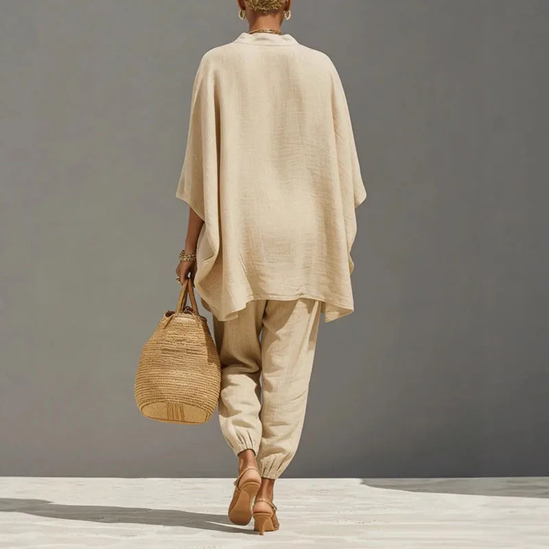 Close-up view of relaxed linen matching set showing deep V-neckline and wide sleeve detail