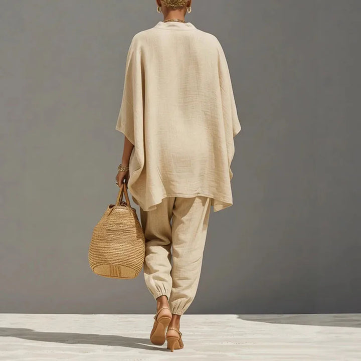 Close-up view of relaxed linen matching set showing deep V-neckline and wide sleeve detail
