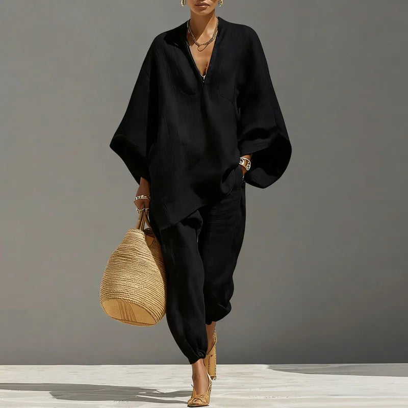 Woman modeling linen matching set showing functional pocket detail on tapered pants