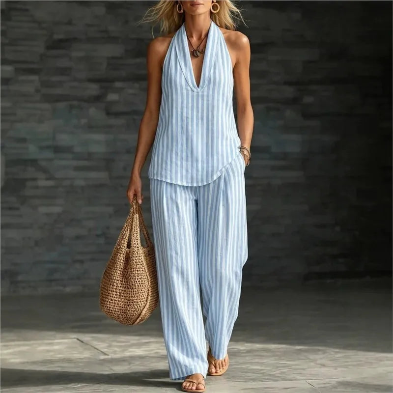 Full length view of women's striped pants set with flowy wide leg silhouette