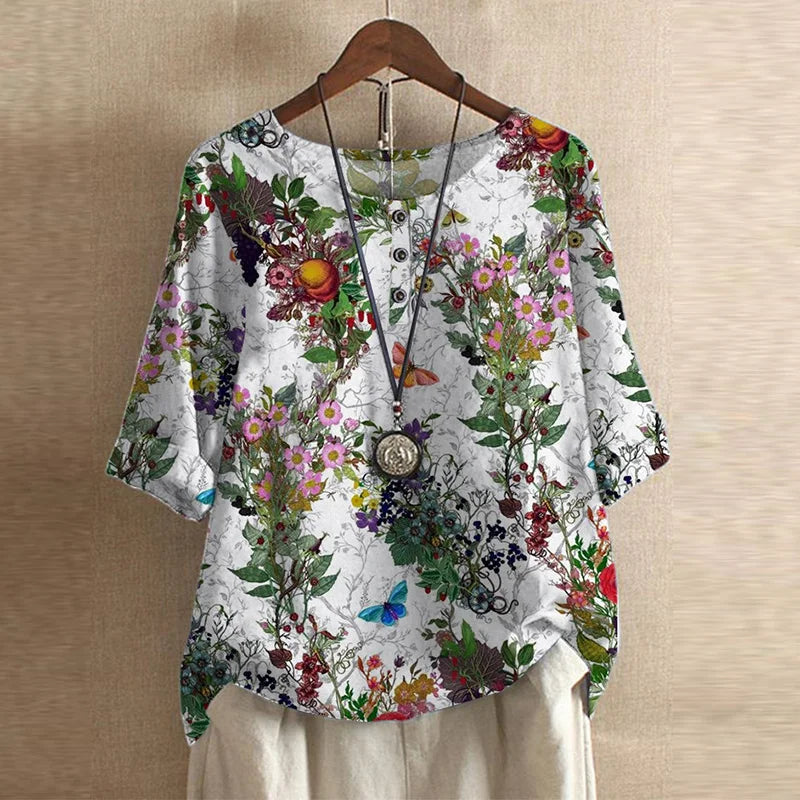 Women's loose fit floral print blouse in muted green tones with embroidery details