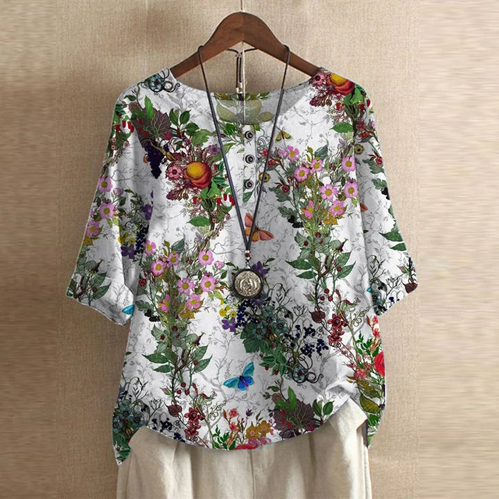 Women's loose fit floral print blouse in muted green tones with embroidery details