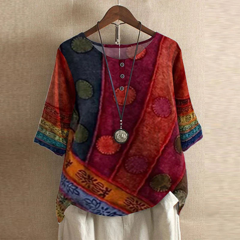 Women's short sleeve blouse with round neckline and botanical floral print in soft colors
