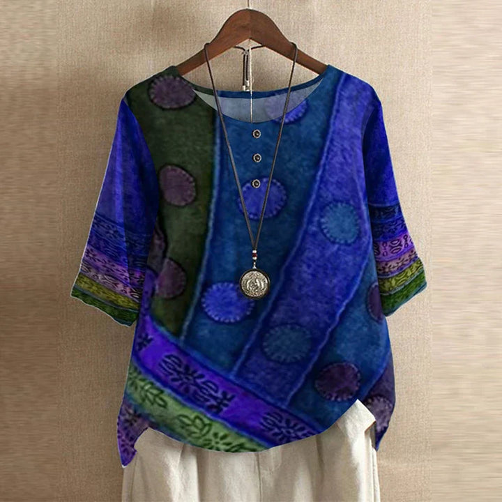 Full front view of vintage floral print blouse with loose relaxed fit and hip length hem