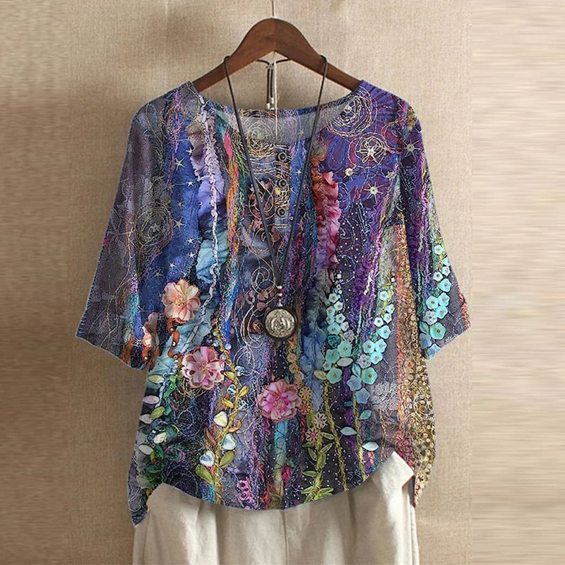 Close-up of round neckline and vintage botanical print detail on women's blouse