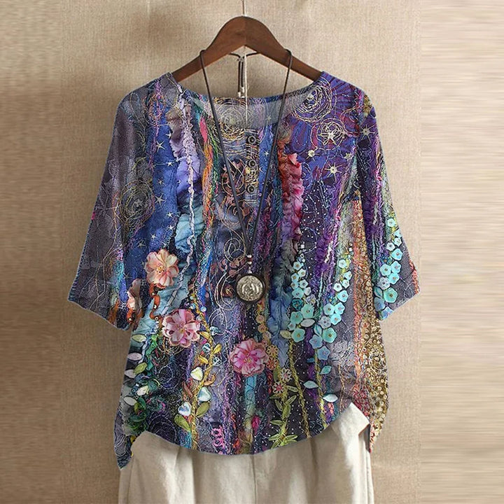 Close-up of round neckline and vintage botanical print detail on women's blouse