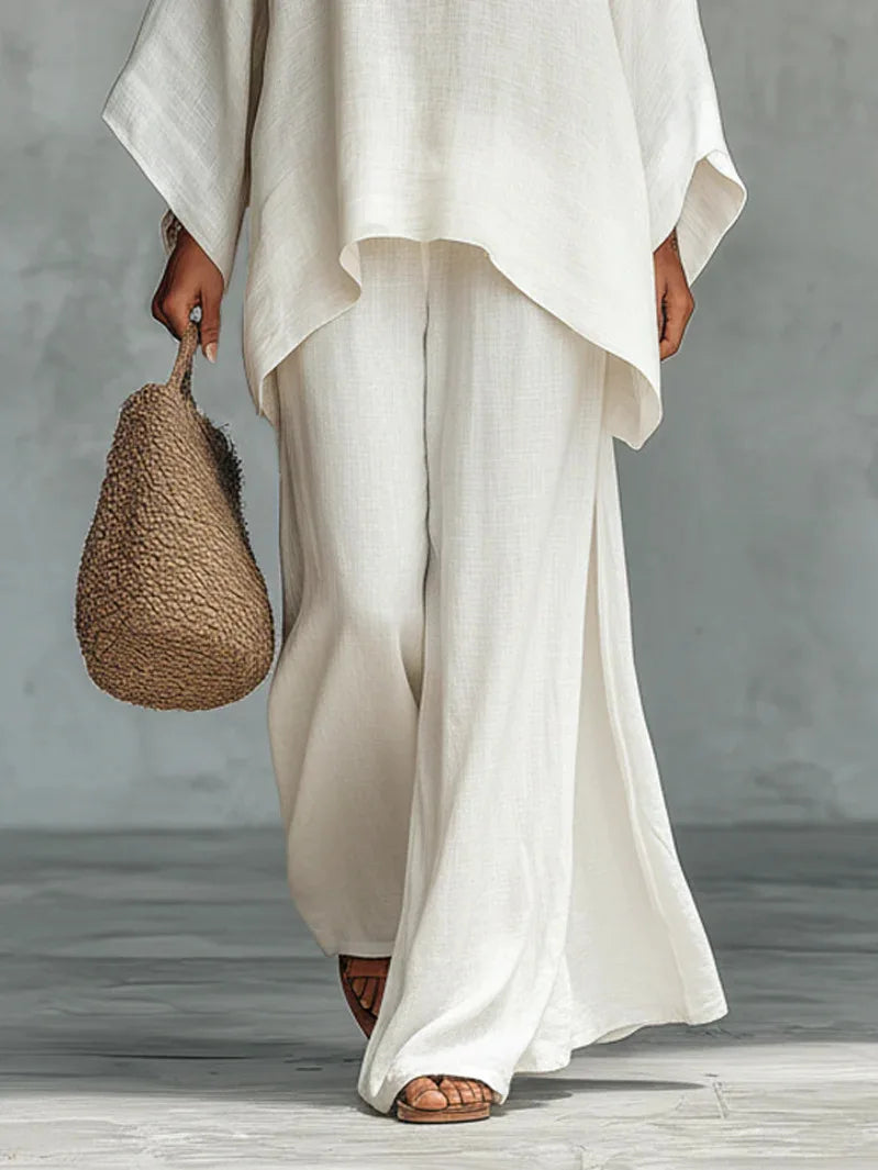 Side view of relaxed fit linen two piece set showing flowing drape and wide leg silhouette
