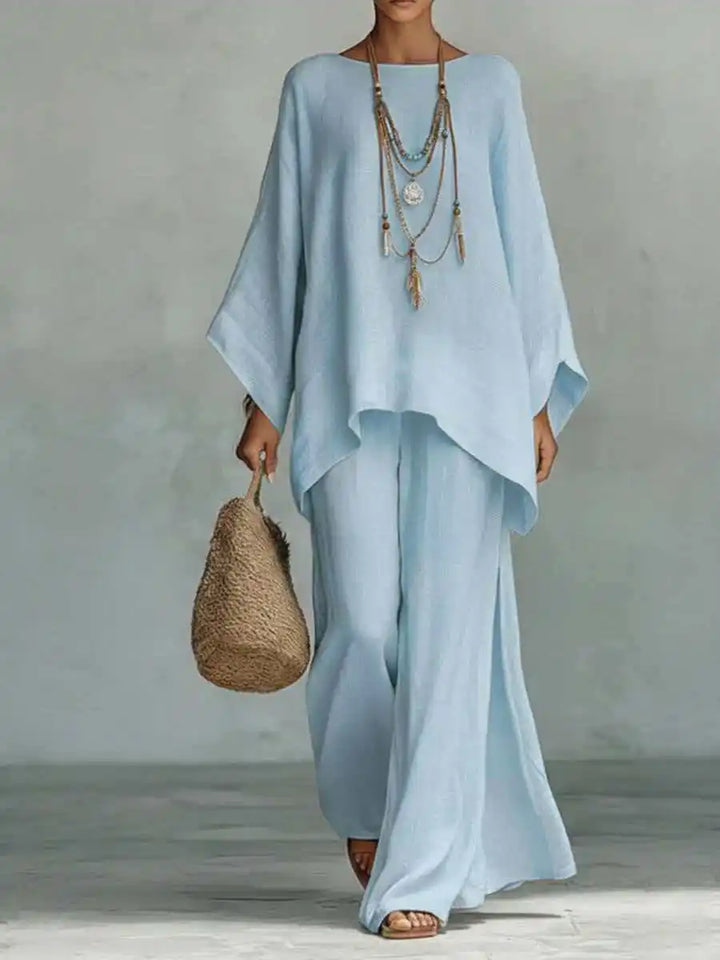 Back view of flowing linen two piece set with wide sleeves and loose fit pants