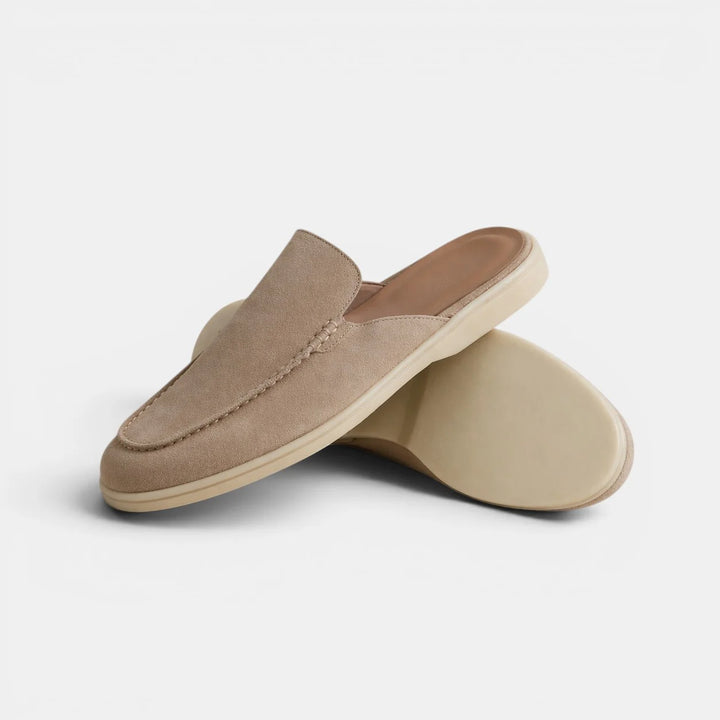 Side profile of men's suede mules with tonal sole and backless loafer silhouette