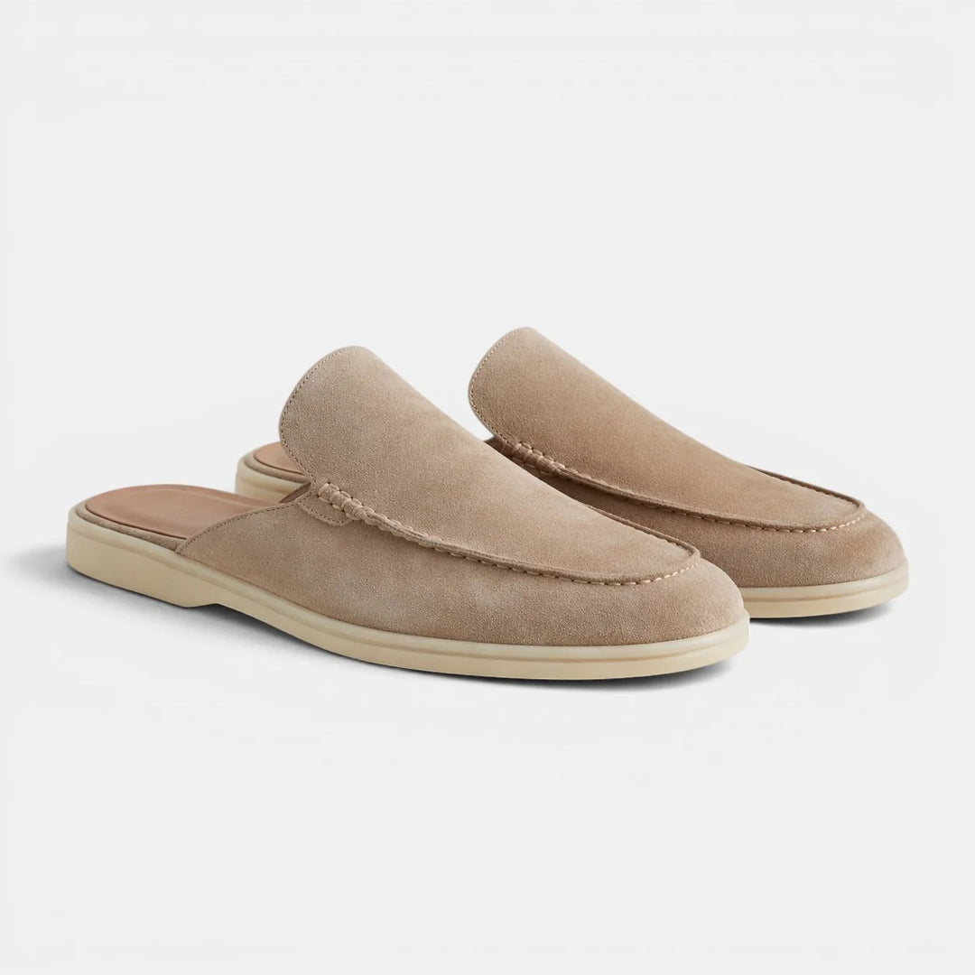 Men's slip-on mules showing textured upper material and comfortable cushioned footbed design