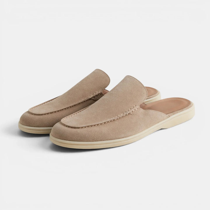 Three-quarter view of men's slip-on mules with textured suede upper and tonal rubber sole