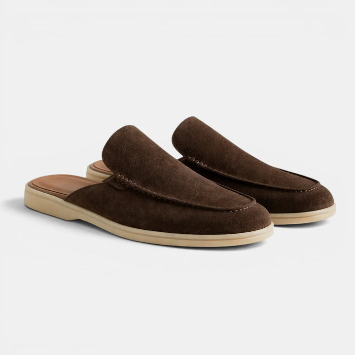 Detail shot of men's suede mules showing contrast topstitching along vamp and flexible sole