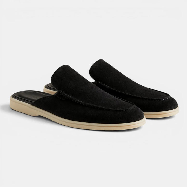 Pair of men's backless mules showing cushioned insole and smooth suede-like finish