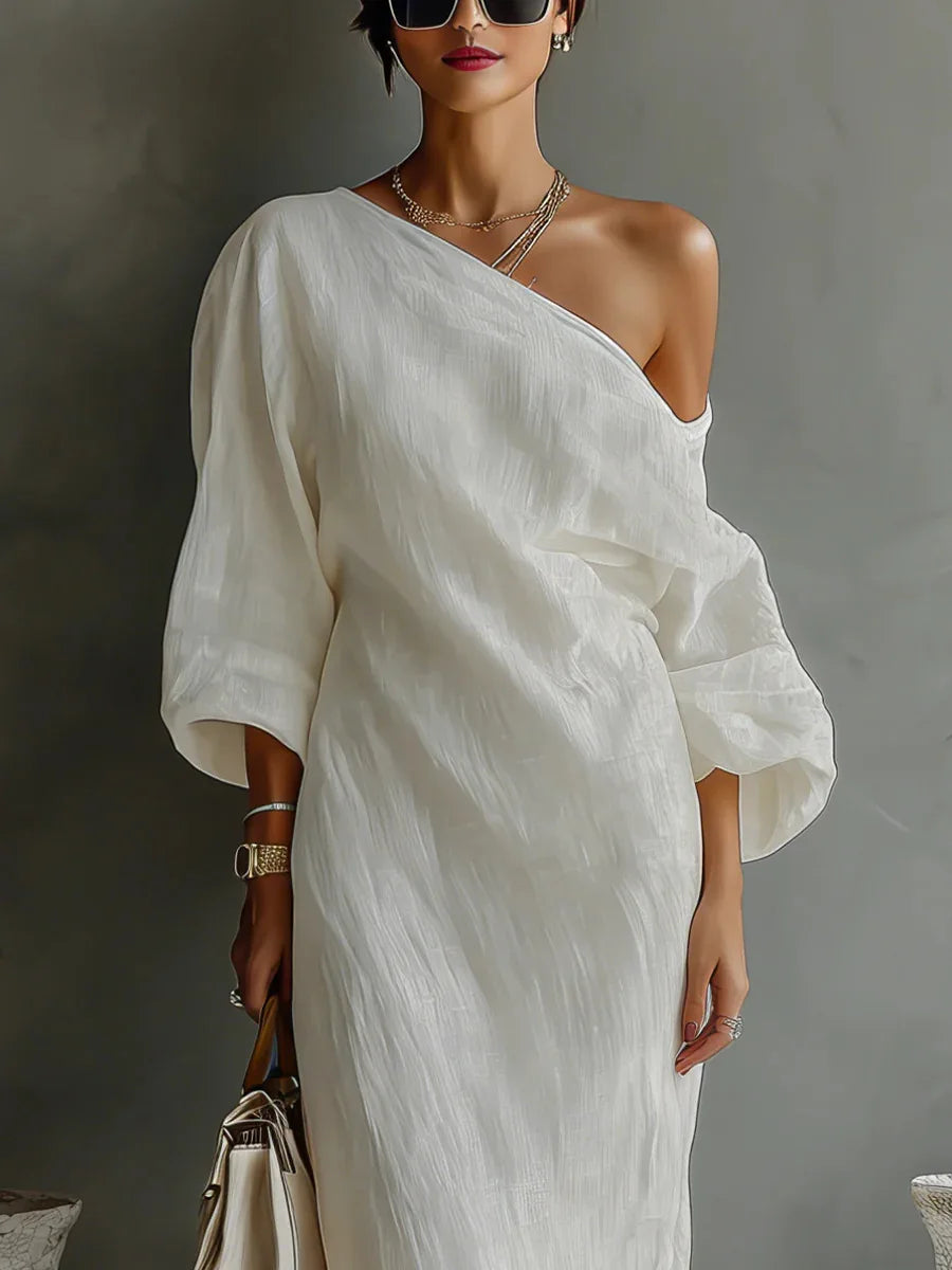 Front view of linen one shoulder dress showcasing the relaxed maxi silhouette and textured fabric drape