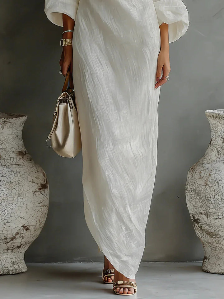 Detail shot of linen one shoulder dress showing the textured woven fabric and loose fit construction