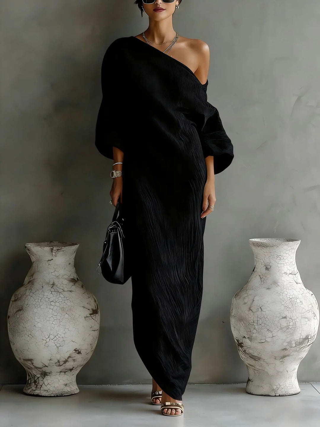 Back view of asymmetrical linen dress showing the relaxed silhouette and flowing maxi length