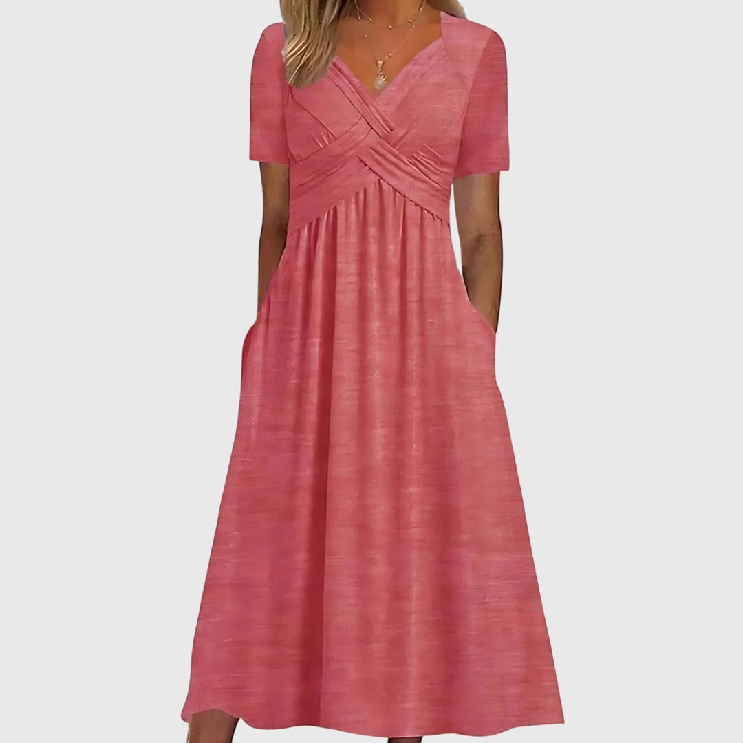 Close-up detail of V-neckline and crossover bodice design on midi dress with tummy control