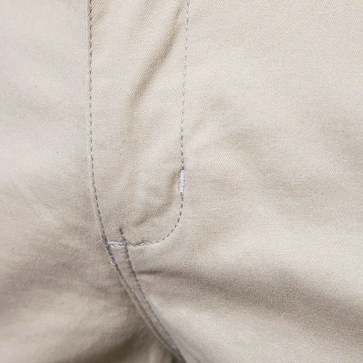 Men's navy chino shorts with button and elastic waistband for secure comfortable fit