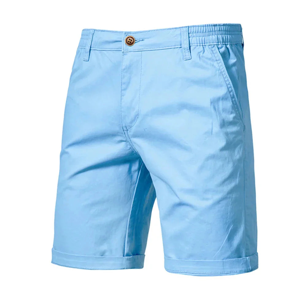 Close-up of button closure and waistband detail on men's mid-rise chino shorts
