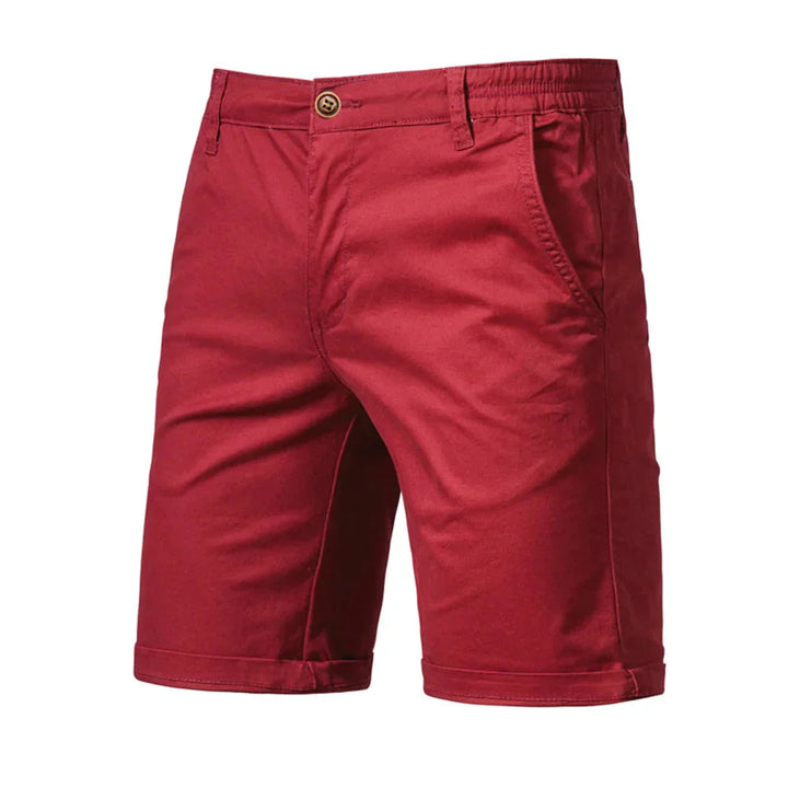 Men's chino shorts in navy displayed flat showing relaxed fit and cuffed hem styling
