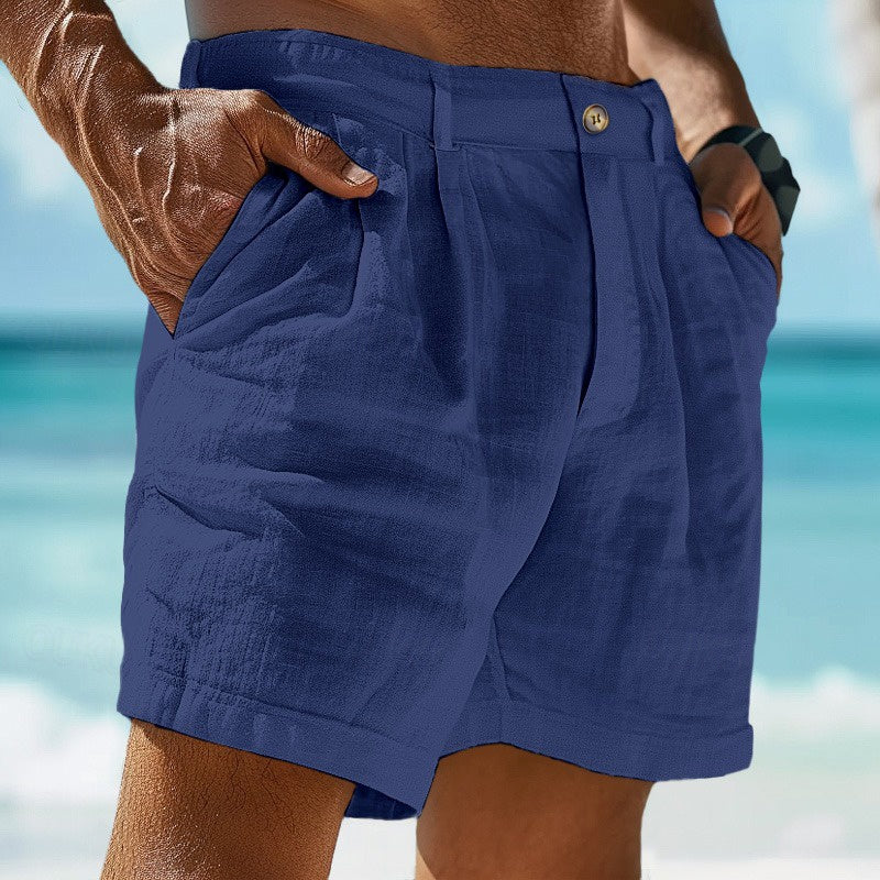 Side view of men's pleated chino shorts displaying structured fabric and tailored silhouette