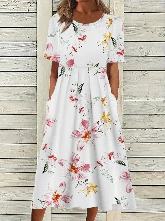 Floral midi dress in white and pink color option featuring delicate bloom print