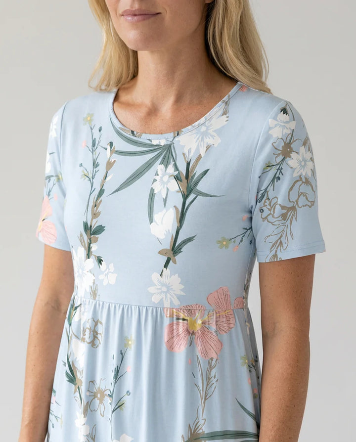 Side view of A-line floral midi dress with gathered waist and short sleeves