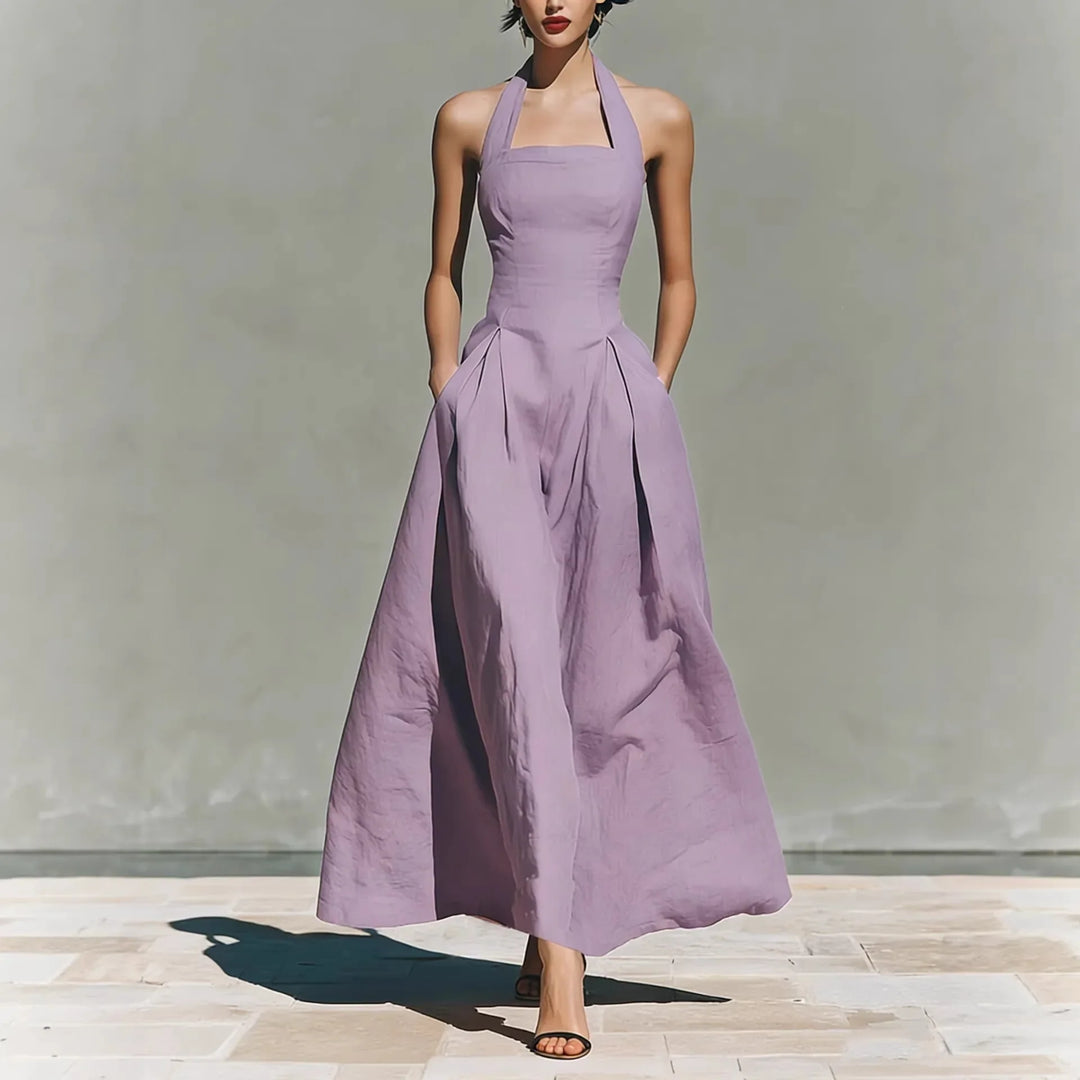 Side view of halter maxi dress showing flowing a-line silhouette and ankle length hem