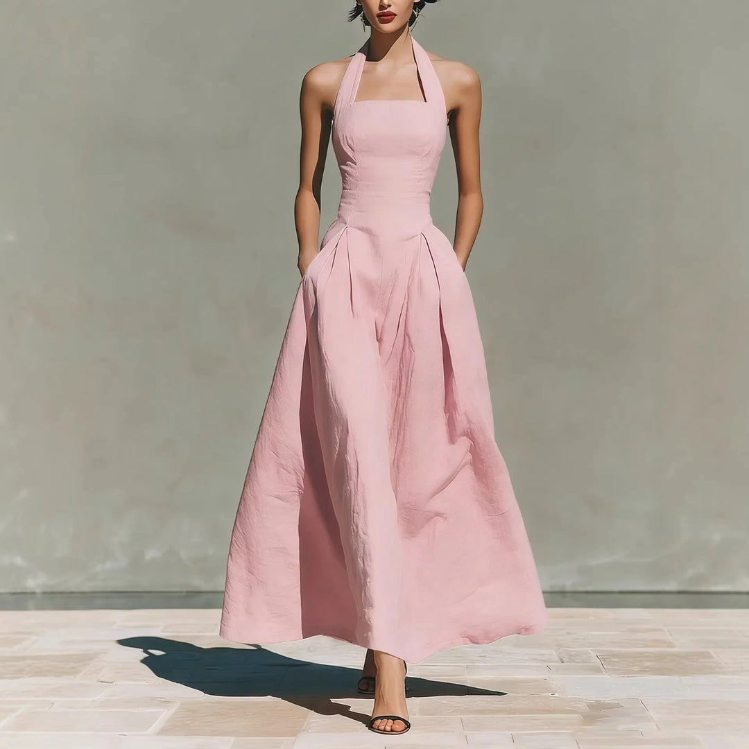 Back view of halter maxi dress featuring open back and tie neckline detail