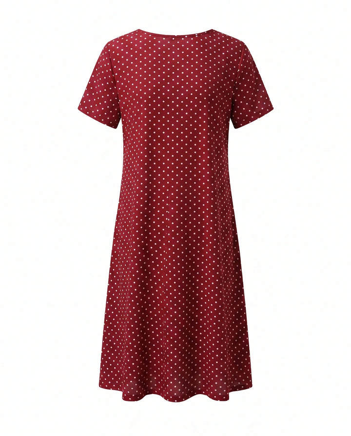 Close-up of polka dot midi dress waistline showing gathered A-line silhouette detail