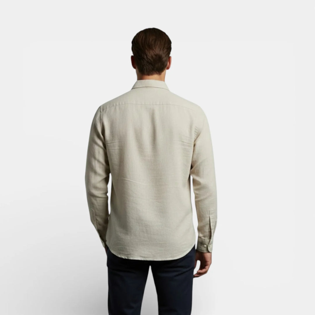 Close-up of men's shirt collar and button placket detail in woven fabric