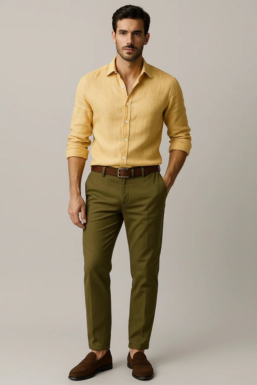 Men's button front shirt in yellow with classic collar and long sleeves styled with olive chinos