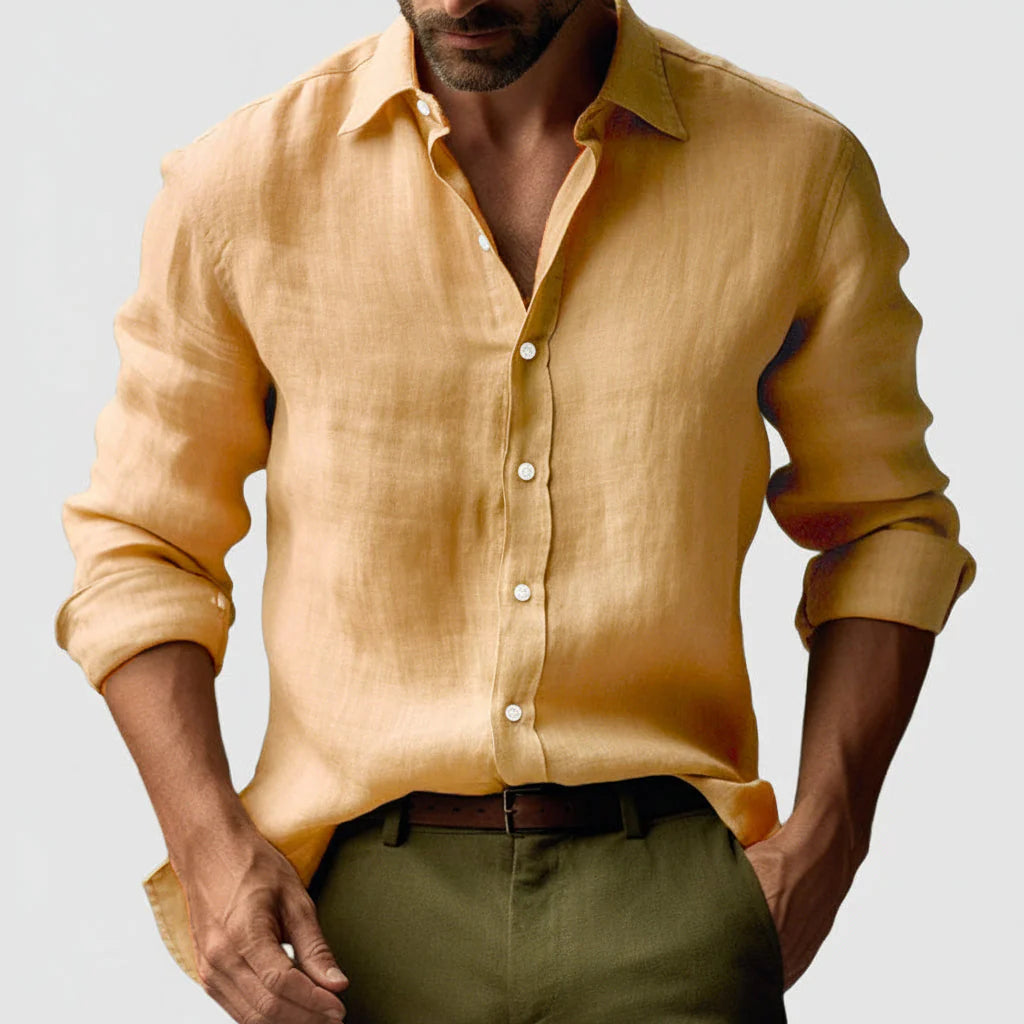 Close-up view of men's button front shirt showing textured woven fabric and button closure detail