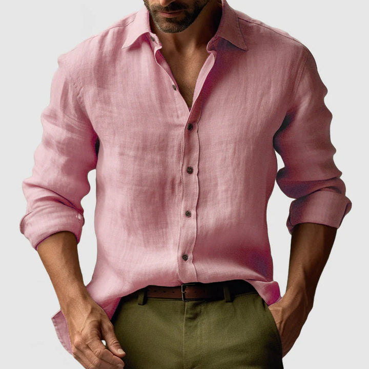 Detail shot of men's shirt cuffs and button closure on textured woven fabric