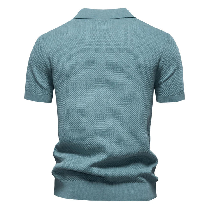 Front view of men's short-sleeve knit polo with split neck and structured fabric