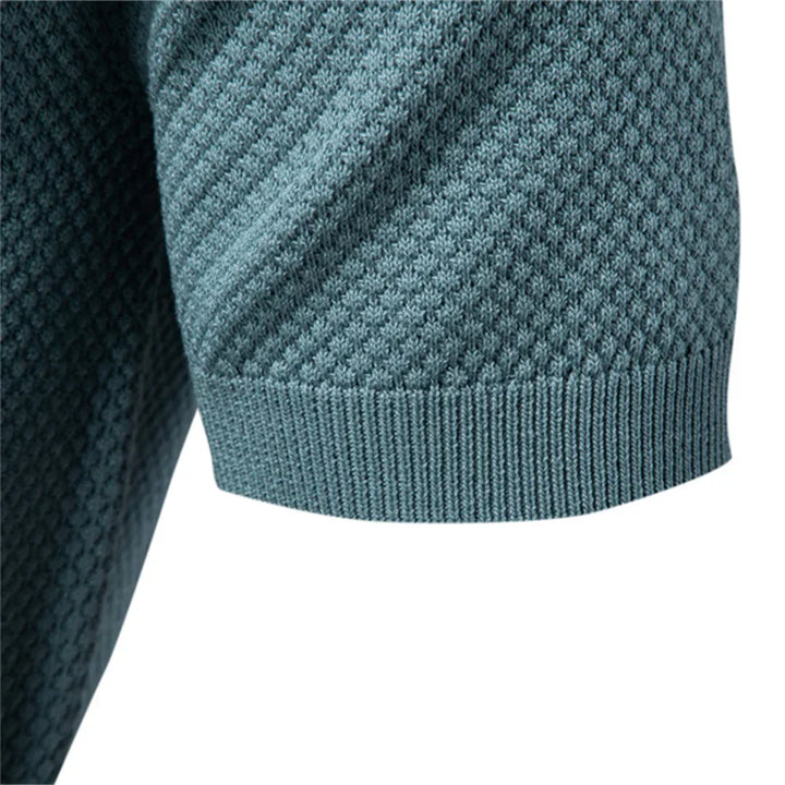 Close-up of textured knit weave pattern on men's polo shirt fabric