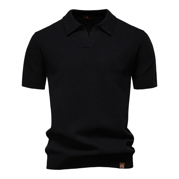 Close-up view of textured knit fabric on men's polo shirt showing structured weave pattern